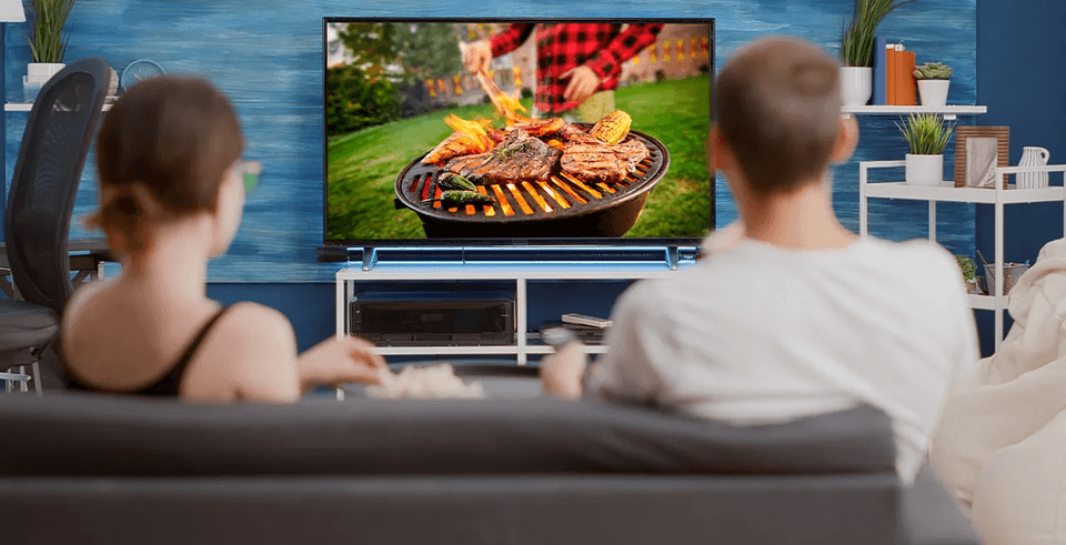 a young couple watching tv