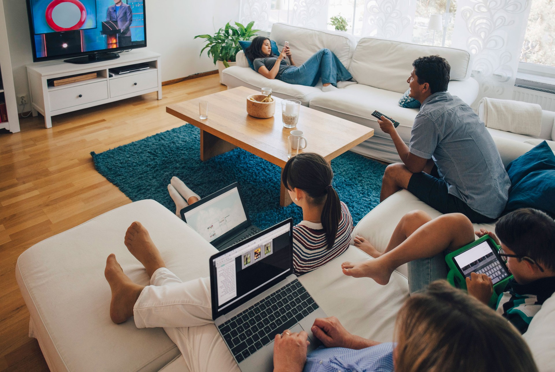 family watching multiple screens