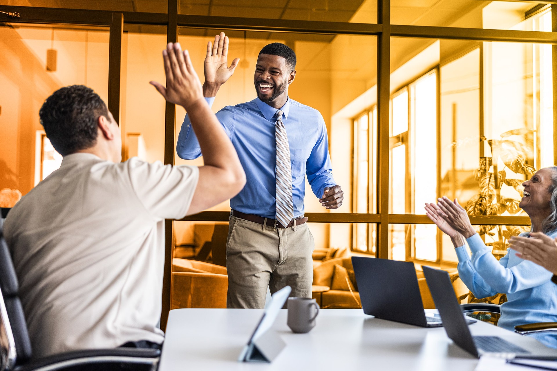 coworkers giving a high five