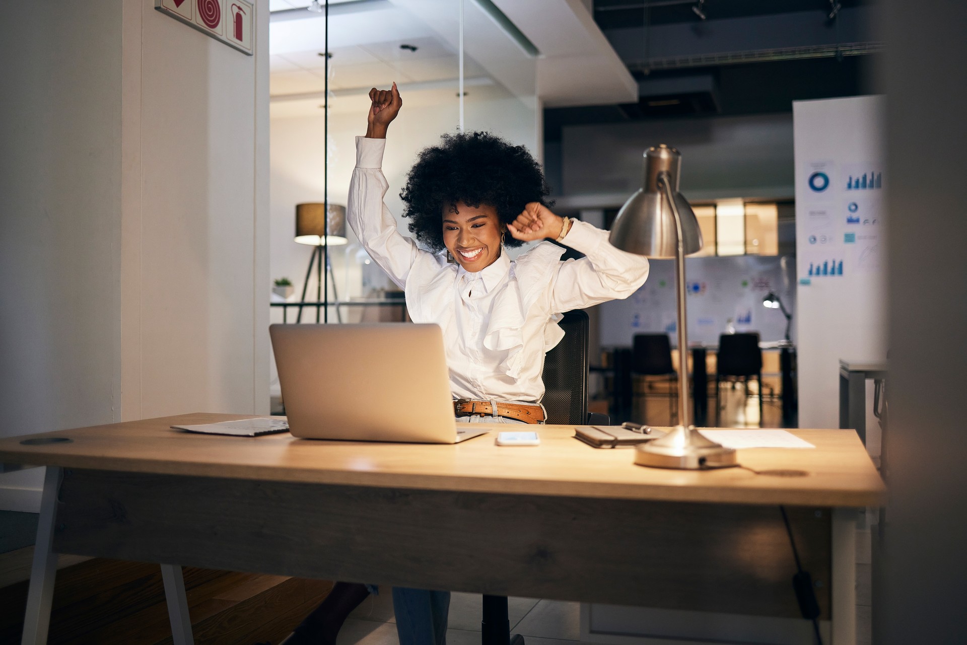 lady celebrating good news at the office