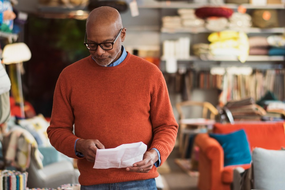 black man in furniture store