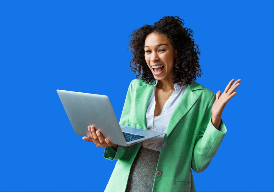 excited lady holding a laptop