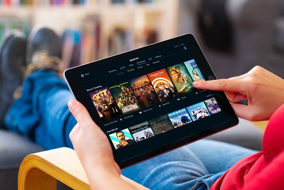 hands holding ipad streaming premium content