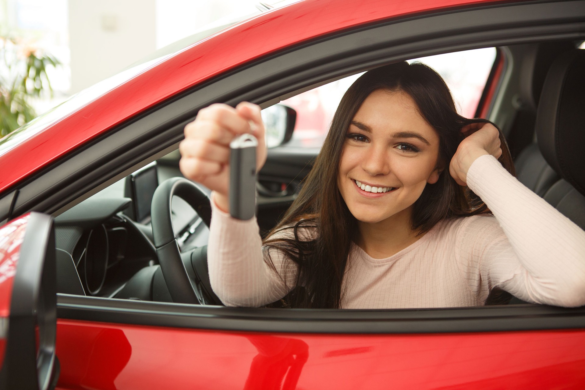 woman in drivers' seat of car