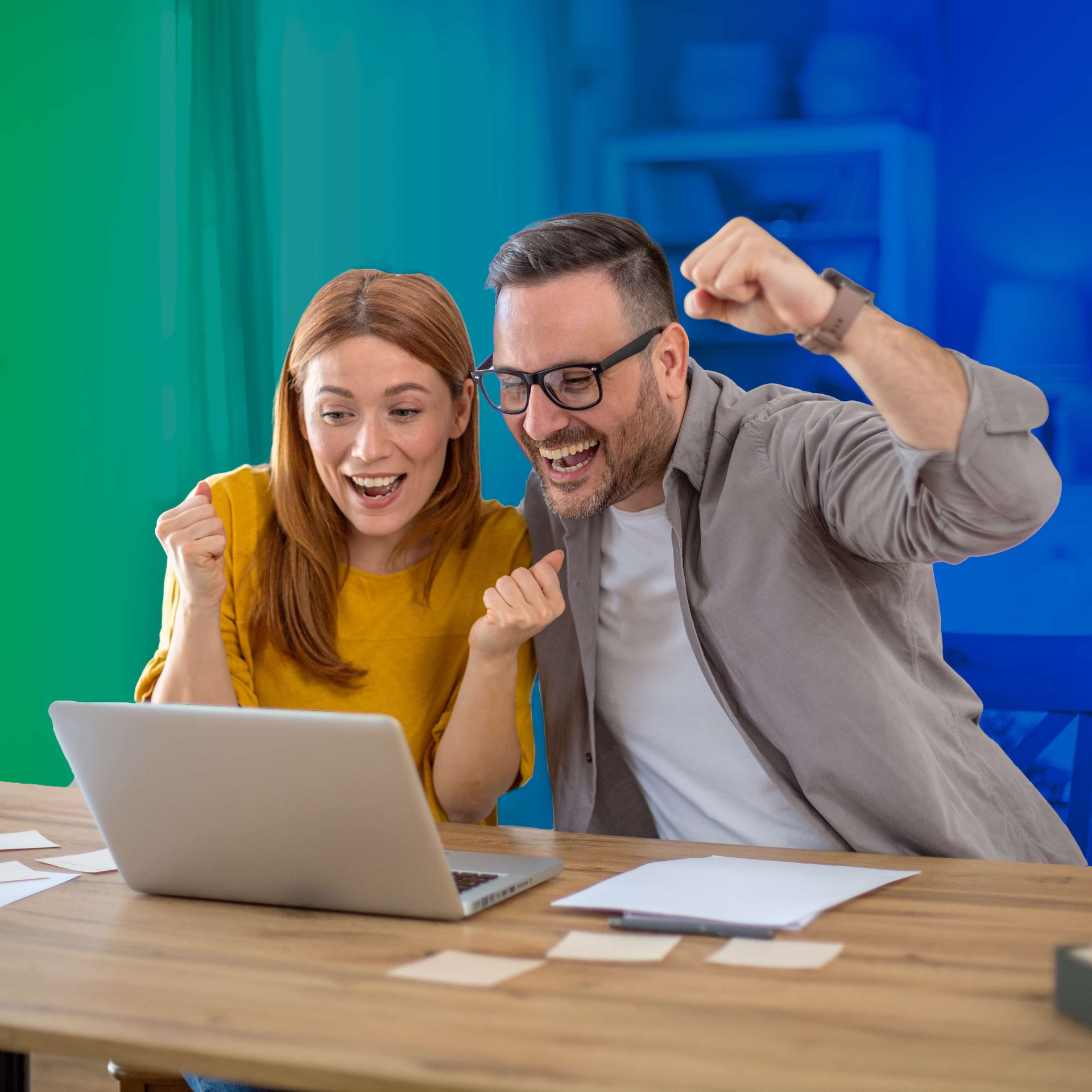 coworkers looking at a computer screen