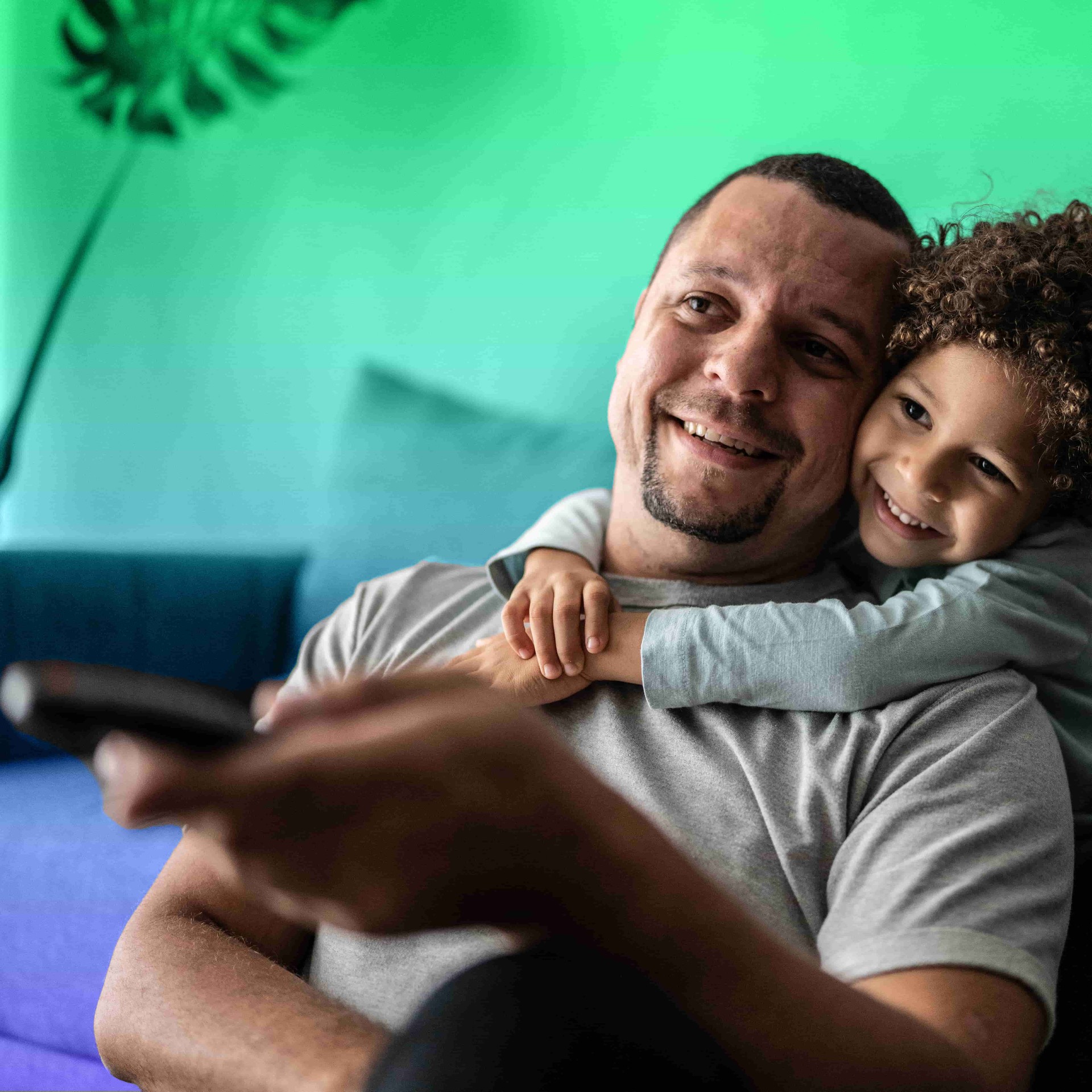 father and daughter watching show on tablet