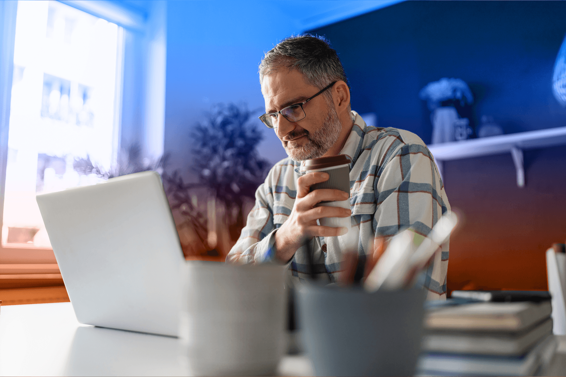 man watching webinar on laptop