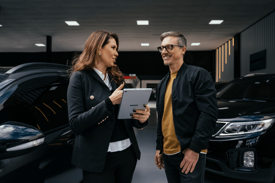 auto salesperson and a customer talking