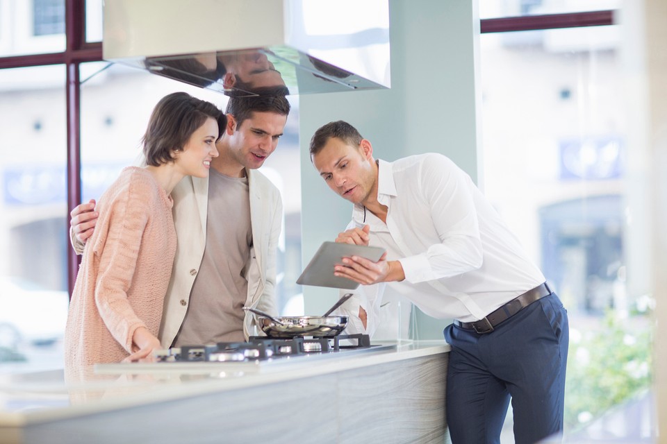 salesman presenting to a couple