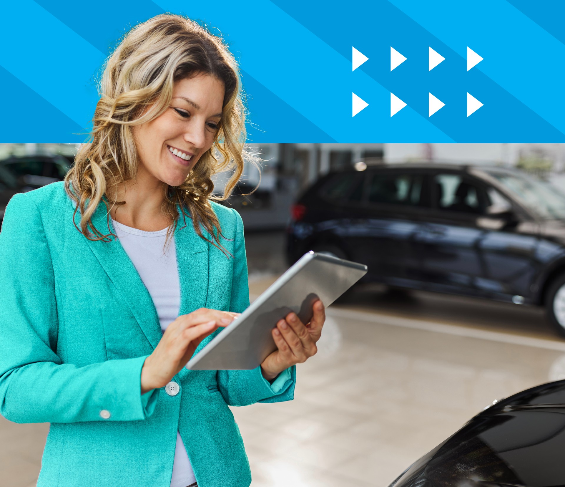 Auto sales person working on a tablet