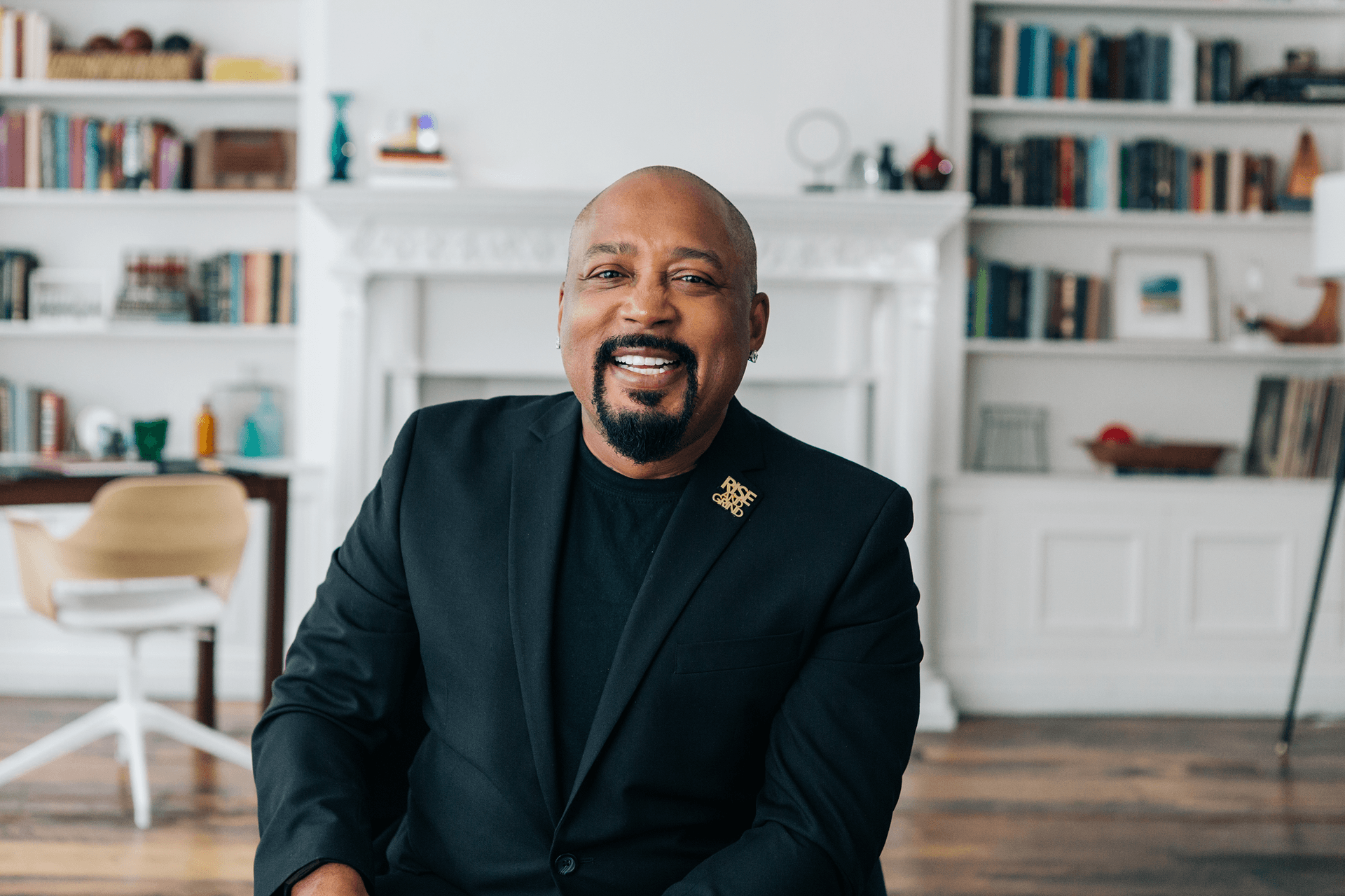 Daymond John with bookcase in background